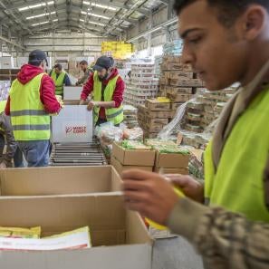 In amman, jordan, workers pack 1,300 prosper global food which will arrive in egypt and trucked across the border into gaza for distribution.