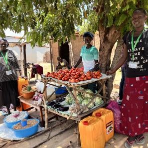 A few people selling fruit and sundries.