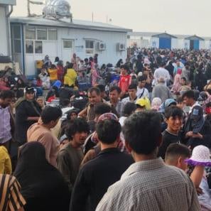 Afghanistan community members assembled in public space.