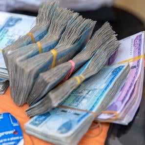 Bundles of currency on a table.