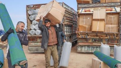 After the 2023 earthquake, prosper global distributed kits for families at camps for displaced people in northwest syria. the kits included mattresses, blankets, solar lamps, rugs, and more.
